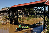 Inle Lake Myanmar. All the buildings are constructed on piles. Residents travel around by canoe, but there are also bamboo walkways and bridges over the canals, monasteries and stupas. 